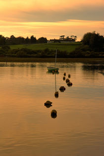 Sunset on calm water by Louise Heusinkveld