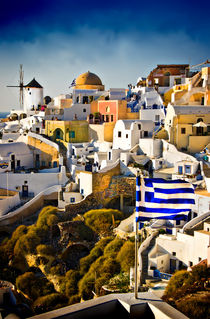 Oia and the Greek flag. by meirion matthias