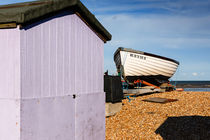 A beach hut and a boat at Greatstone Beach. by Tom Hanslien