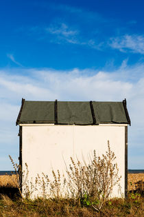 White beach hut at Greatstone Beach. by Tom Hanslien