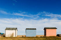 Three huts on the beach. by Tom Hanslien