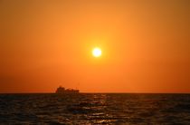 Cargo Ship At Sunset by Malcolm Snook