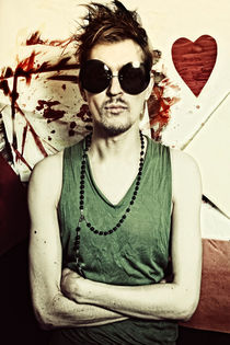 Portrait of young punk in round sunglasses von Igor Korionov