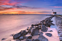 The lighthouse of Marken in The Netherlands at sunrise by Sara Winter