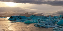 Sunset at the famous glacier lagoon at Jökulsárlón by creativemarc