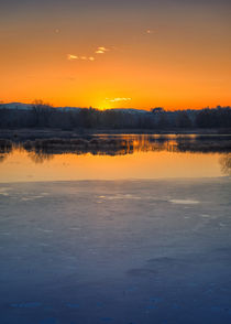 Sunset on iced lake by Giordano Aita
