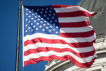 US Flag and the capitol dome by Brent Olson