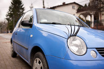 Blue funny car with eyelashes by Arletta Cwalina