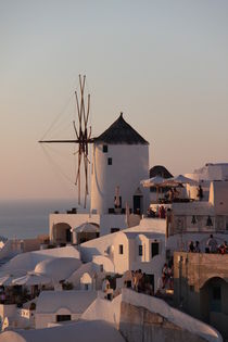 Wind mill during sunset in Thira by gunter70