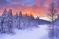 Sunrise over a river in winter near Levi, Finnish Lapland by Sara Winter