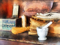 Mortar and Pestle and Box of Cocoa von Susan Savad