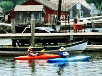 Orange and Blue Kayaks by Susan Savad