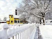Yellow House with Snow Covered Picket Fence by Susan Savad