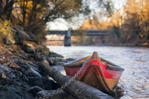 Small boat on the riverside by Gerhard Petermeir