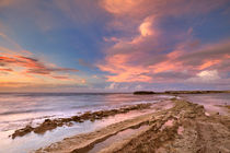 Rocky coast on the island of Curaçao at sunset by Sara Winter