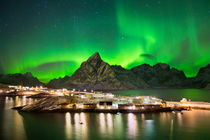 Aurora borealis over a village on the Lofoten in Norway by Sara Winter