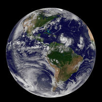 Two tropical storms forming in the Atlantic Ocean. by Stocktrek Images