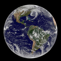 View of full Earth showing low pressure systems. by Stocktrek Images