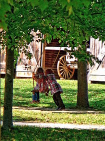 Two Sisters Playing on Swing by Susan Savad