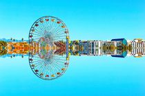 reflection ferris wheel with buildings and blue sky von timla