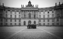 German soldiers standing on top of the empty library monument by Micha Ulman in Berlin by Sharon Yanai