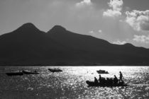 boats in front of a mountain with two tops by Jessy Libik