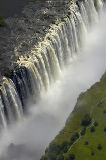 Tourists on pathway viewing Aerial view of Victoria Falls or... von Danita Delimont