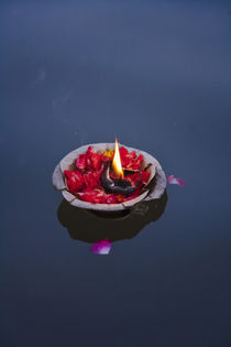 Flower lamp on the Ganges River, Varanasi, India by Danita Delimont