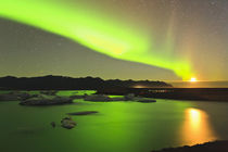 Rising moon and Aurora Borealis and moonrise over icebergs i... by Danita Delimont