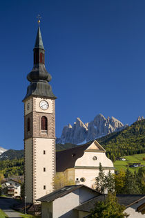 Autumn view of Sant Jakob Church with the Dolomites beyond, ... by Danita Delimont