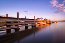 Jetty of lake Altmühlsee during sunset by raphotography88