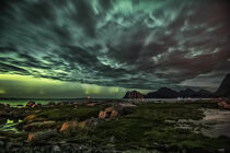 Aurora Borealis on sky in Lofoten islands by Stein Liland