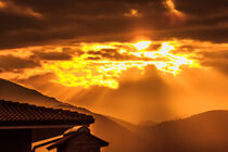 a golden sunset of threatening clouds  by susanna mattioda