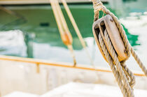 Marine background, sailing boat wooden pulley by Alex Winter