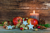 Christmas decoration with food and burning candle by Alex Winter