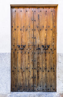 Brown old wooden front door house entrance of mediterranean house by Alex Winter