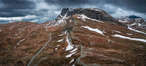 Landscape with road and mountain ridge in Jotunheimen National Park in Norway from above von Bastian Linder