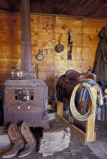 NA, USA, Oregon, Seneca, Ponderosa Ranch Line shack with cowboy gear PR by Danita Delimont