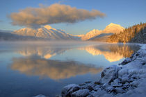 Fog rises from Lake McDonald in Glacier National Park in Montana by Danita Delimont