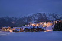 Buildings lit up at dusk, Courchevel, French Alps, France von Panoramic Images