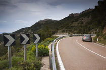 Car on the road, Genna Silana Pass, Gennargentu Mountains, Sardinia, Italy von Panoramic Images