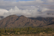Clouds over mountains by Panoramic Images