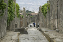 Tourists at old ruins, via di Mercurio, Pompeii, Naples, Campania, Italy by Panoramic Images