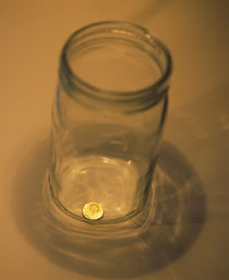 High angle view of a penny in a jar by Panoramic Images