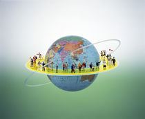 Small figures standing on circular yellow catwalk surrounding floating earth by Panoramic Images