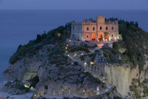 High angle view of a church lit up at dusk on a cliff by Panoramic Images