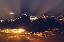 Sun rising behind dark clouds, Montana, USA. von Panoramic Images