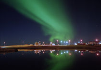 Aurora Borealis over a town, Njardvik, Iceland by Panoramic Images