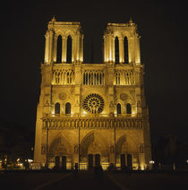 Facade of a cathedral lit up at night, Notre Dame De Paris, Paris, France by Panoramic Images