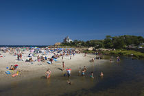 Tourists on the beach by Panoramic Images